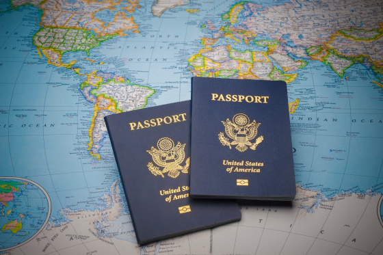 Two United States passports sit on world map